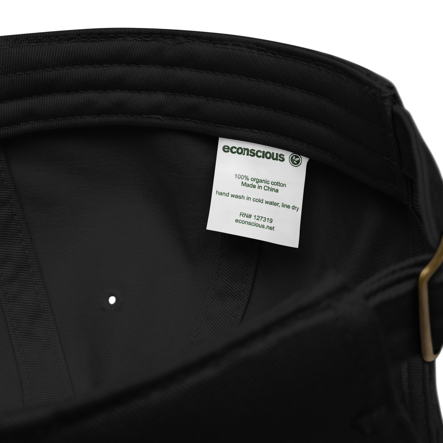 Vue intérieure d’une casquette classique Sortie Longue en coton biologique, finitions internes et bande de maintien visibles.