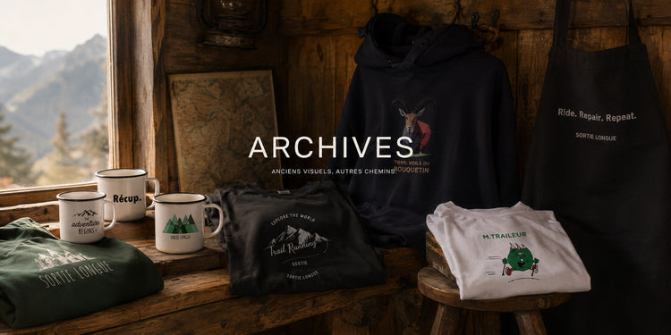 Collection Archives Sortie Longue avec anciens designs outdoor sur vêtements, mug émaillé et accessoires, dans une ambiance montagne sobre et naturelle.