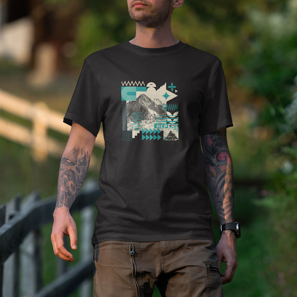 T-shirt unisexe Sortie Longue porté en extérieur sur un chemin, motif graphique central « Repère » mêlant relief photographique et formes abstraites. Photo lifestyle nature.